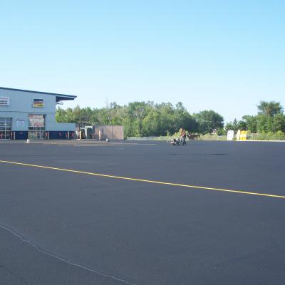 Sealcoating, Crack Sealing and Line Striping at Land M